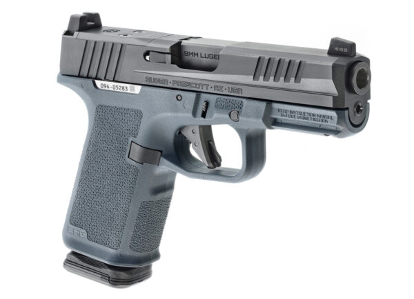 Close-up of the Ruger RXM red dot sight mounted on a handgun, featuring a durable aluminum body, multi-coated lens, and adjustable brightness settings for precision aiming.