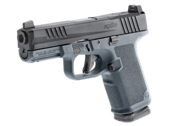Close-up of the Ruger RXM red dot sight mounted on a handgun, featuring a durable aluminum body, multi-coated lens, and adjustable brightness settings for precision aiming.